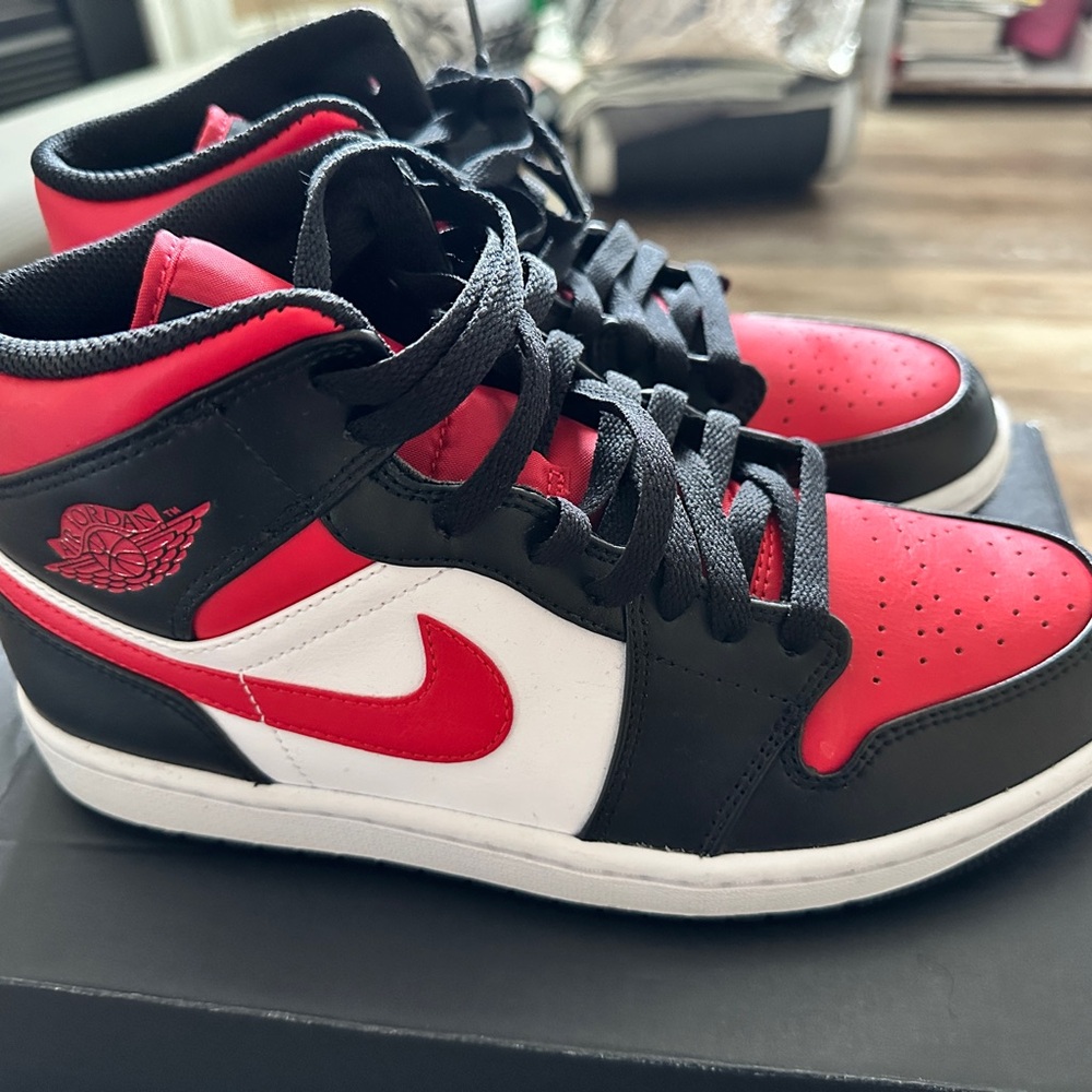 Air Jordan 1 mid Black, Red, and White Sneakers